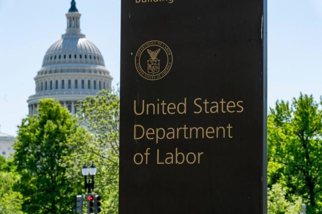 In this May 7, 2020 file photo, the entrance to the Labor Department is seen near the Capitol in Washington. 