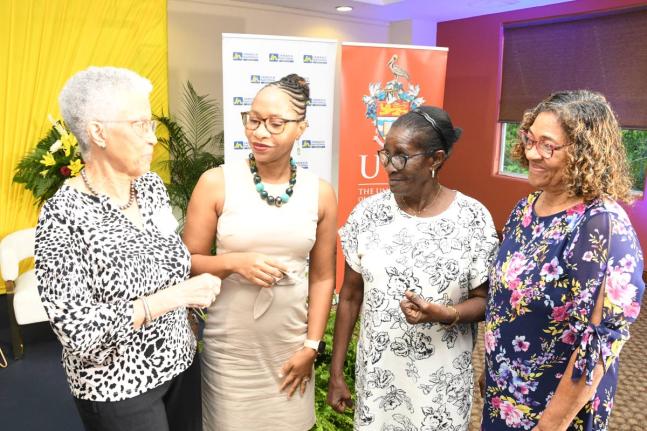 Professor Elsa Leo-Rhynie (left), former chair of the Dudley Grant Memorial Trust, has the captive attention of (from second left) Professor Zoyah Kinkead-Clark, Early Childhood Care and Education, The University of the West Indies (UWI); Alma Jean Panton,