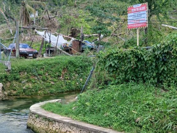 A warning sign erected by the Westmoreland Public Health Department at a stream in the parish. 