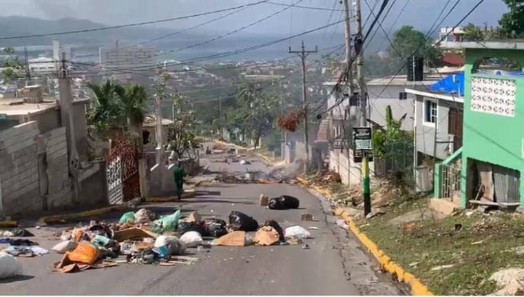 Roadblocks mounted by residents of Boulevard in Rose Heights, St James on December 24, 2025 to protest the absence of water in the area.