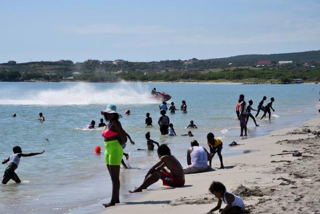 People relax along Hellshire Beach in St Catherine.