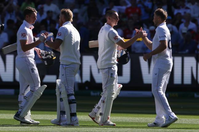 
England’s Jamie Smith (left) Ben Stokes (second left) Harry Brook, and Joe Root (right) shake hands after defeating Australia on day two of their Ashes cricket Test match in Melbourne yesterday.