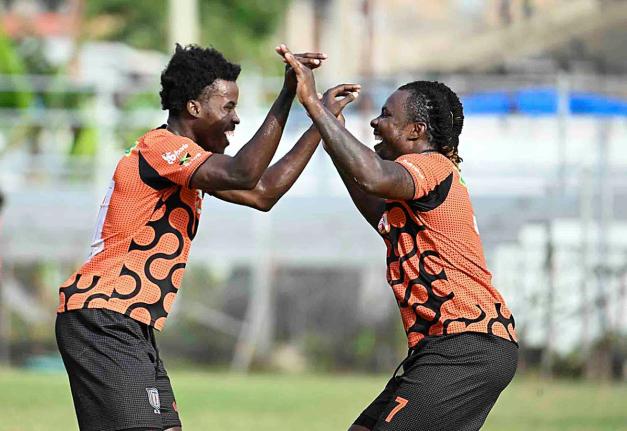 Tivoli Gardens FC goalscorer Rodico Wellington (right) celebrates with Daniel Watson during their Jamaica Premier League match against Chapelton Maroons at the Edward Seaga Sports Complex yesterday. Tivoli won 2-0.
