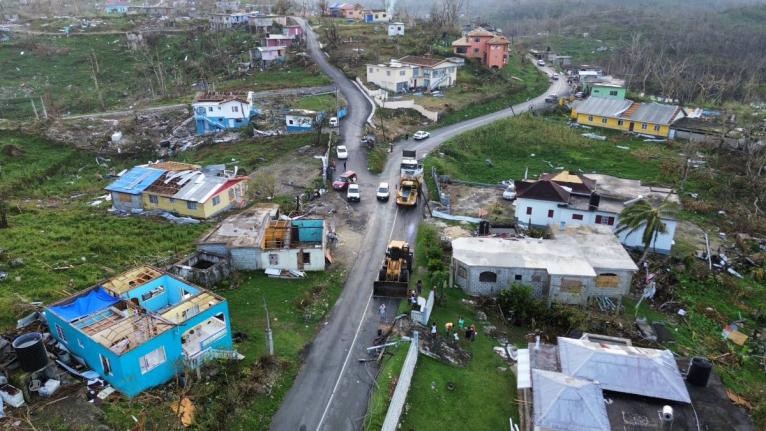 A road is being cleared of debris after the passage of Hurricane Melissa