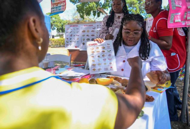 Dietitian Vanessa Turner (right) offers a nutritional counselling session to Roxeen English (left) during a health fair held in Kingston last March. 