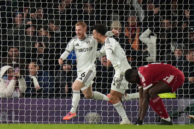 Fulham’s Harrison Reed (left) celebrates after scoring his side’s second goal during the English Premier League match between Fulham and Liverpool in London yesterday.