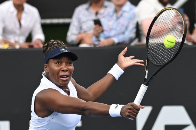 Venus Williams hits a backhand to Magda Linette during an ASB Classic Women’s Tennis Tournament singles match in Auckland, New Zealand yesterday.