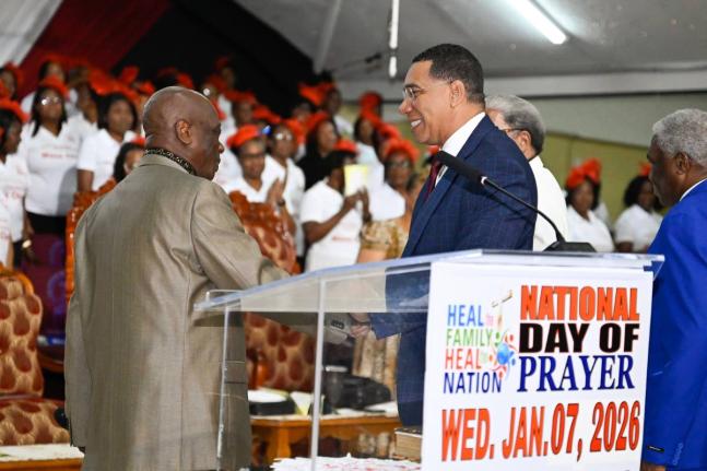 Prime Minister Dr Andrew Holness (right) greets Founder of Power of Faith Ministries International, Bishop Dr Delford Davis, during the ‘Heal the Family, Heal the Nation’ Day of Prayer service on Wednesday, January 7, 2026. The service was held at the 