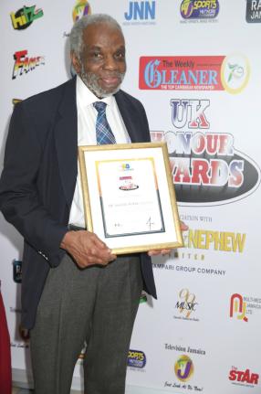 Dr Aggrey Burke proudly holds the Weekly Gleaner Honour Award Certificate which was presented to him in October 2023. 