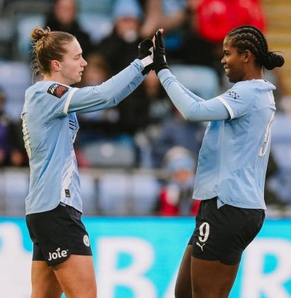 Manchester City’s Khadija Shaw (right) congratulates teammate Miedema after her assist led to the latter’s goal during a Women’s Super League football game against Everton at the Joie Stadium in Manchester, England, yesterday.