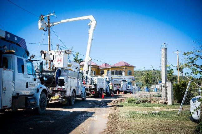 Several bucket trucks seen recently on Carawina Road in Westmoreland as JPS continues several kilometers of repair work along the power line section leading to the National Water Commission’s Roaring River Pump. The energisation of the lines aims to rest