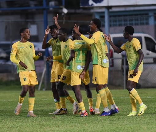 Treasure Beach FC players celebrate a goal against Molynes United during their Jamaica Premier League football match at he Drewsland stadium on Sunday.
