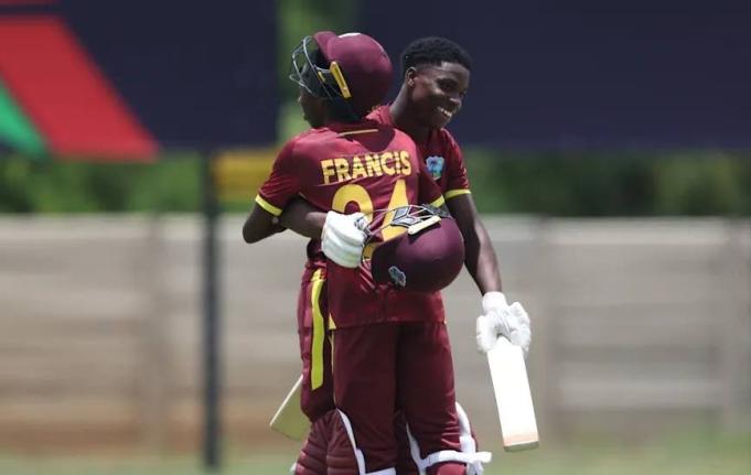 West Indies Under-19 batsmen Tanez Francis (left) and Shama Apple embrace in celebration of the latter’s century in an ICC U19 World Cup warm-up game against Japan. Francis also scored a century.