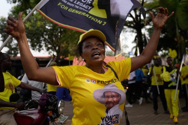 A woman celebrates President Yoweri Museveni’s victory in the presidential election in Kampala, Uganda.