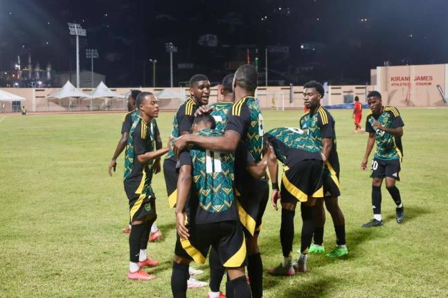 Jamaica’s Reggae Boyz celebrate Nickalia Fuller’s lone strike in an international friendly against Grenada at the Kirani James Stadium in St George’s on Sunday.