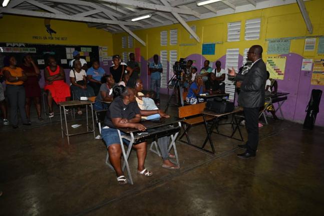  Chief Executive Officer (CEO) of the St Thomas Municipal Corporation, Kevin McIndoe (left), speaks with Councillor Andrea Patience of the Llandewey Division (centre) and Director of Planning at the St Thomas Municipal Corporation, Shavar Ellis, during a t