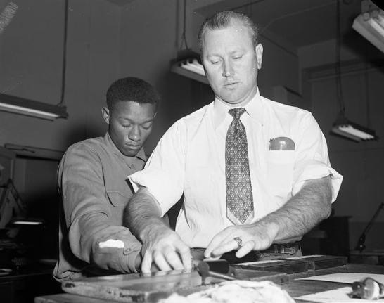 In this photo provided by the Dallas History & Archives Division, Dallas Public Library, Tommy Lee Walker, a Black man from Texas, United States, is fingerprinted after his arrest in January 1954, for the rape and murder of Venice Parker, a white woman. 