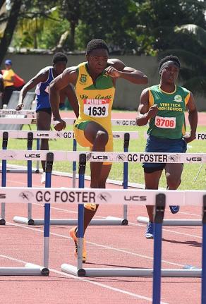 Ian Allen Marquese Page (left) of St Jago High wins the Class Two boys’ 110m hurdles event at the Central Hurdles, Relays and Field Events meet in 13.67 seconds at G.C. Foster College last Saturday.  Jhabarie Whyte (right) of Vere Technical was third in 