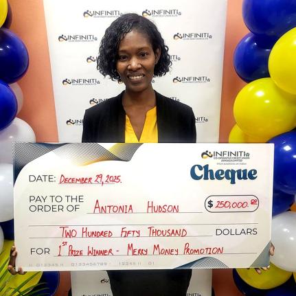 Infiniti Co-operative Credit Union’s first-place winner Antonia Hudson holds her presentation cheque, a share of the $500,000 Merry Money Promotion prize.
