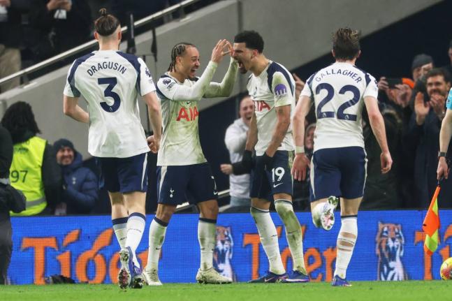 Tottenham’s Dominic Solanke (19) is congratulated after scoring his side’s second  goal during the English Premier League match between Tottenham Hotspur and Manchester City in London yesterday.