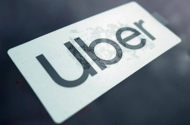 An Uber sign displayed inside a car in Palatine, Ill, February 10,2022. 