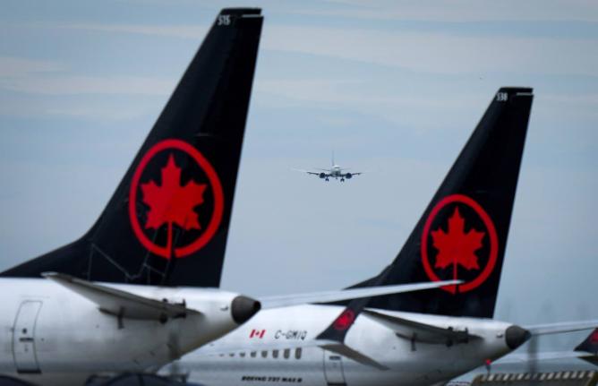 Air Canada aircraft sit parked at Vancouver International Airport in Richmond, British Columbia, August 18, 2025. (Darryl Dyck/The Canadian Press via AP, file)