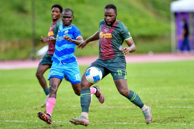 Jourdain Fletcher (right) of Montego Bay United FC prepares to shoot, while Michael Odupe of Molynes United FC looks on during the Jamaica Premier League football match at Stadium East in Kingston on Sunday, October 12, 2025. Fletcher scored twice as MoBay