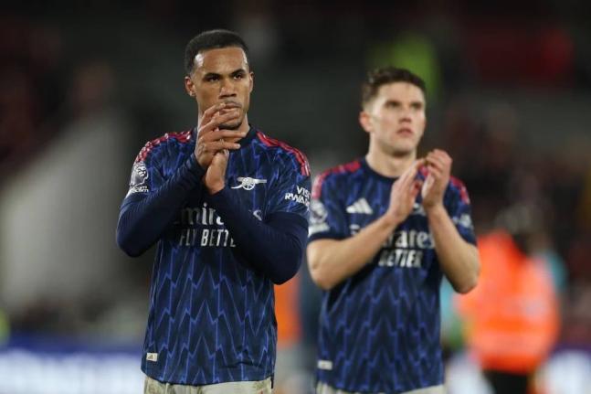 Arsenal’s Gabriel (left) and Viktor Gyoekeres leave the pitch after the English Premier League match between Brentford and Arsenal in London yesterday.