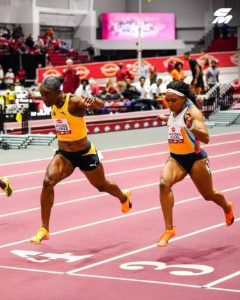 
St Lucia’s Julien Alfred outdips the United States Jacious Spears during the Tyson Invitational at the Randal Tyson Track Center in Fayetteville on Friday, February, 13, 2026.