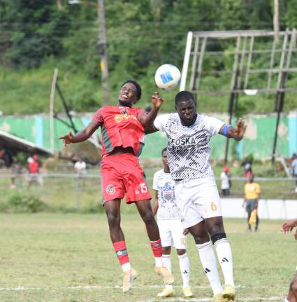 Montego Bay United’s Nashordo Gibbs (left) and Cavalier FC’s Jeovanni Laing battle for the ball during their Jamaica Premier League game at Jarrett Park in Montego Bay yesterday.