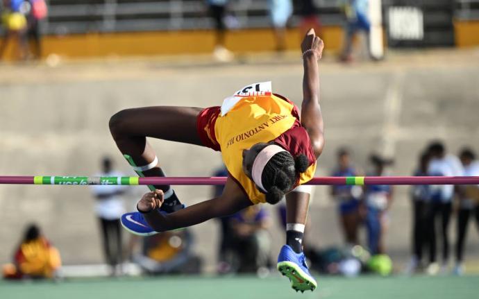 Port Antonio High School’s Cavel Wesley clears the high jump bar on her way to an Eastern Athletics Championships Class 3 record, 1.60 metres, at the National Stadium yesterday.