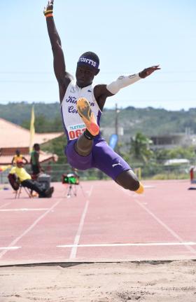 Alexander Pusey of Kingston College wins the Class Two boys’ long jump with a leap of 7.05 metres on day one of the Corporate Area Athletics Championships at Ashenheim Stadium, Jamaica College, yesterday.