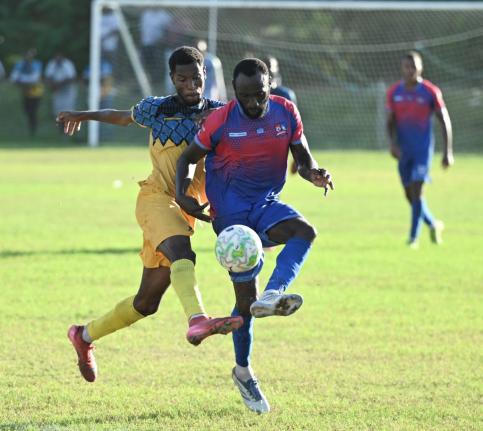Dunbeholden’s Damion Binns (right).