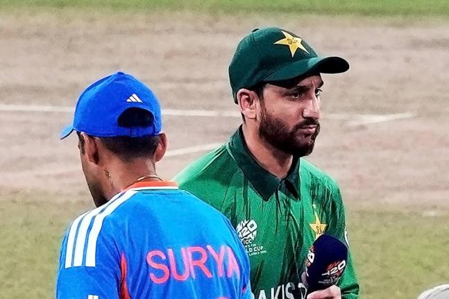 India’s captain Suryakumar Yadav (left) and Pakistan’s captain Salman Ali Agha walk past each other after the coin toss of the T20 World Cup cricket match in Colombo, Sri Lanka on February 15.