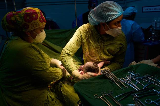 Doctors assist in a birth at the Ramón González Coro Maternity Hospital in Havana, Cuba, Friday, Feb. 20, 2026. 