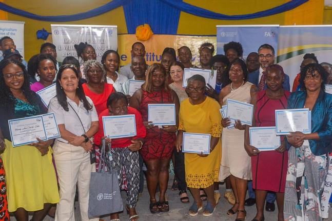 Participants in the FAO’S Improving Rural Livelihoods Through Resilient Agrifood Development initiative show off their certificates during Monday’s graduation.