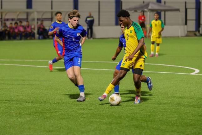 Jamaica Under-20’s Jahmarie Nolan turns away from Bonaire defender Ivar Bakelaar during the Concacaf Under-20 Qualifier at the Stadion Rignaal “Jean” Francisca in Willemstad, Curaçao on Monday.