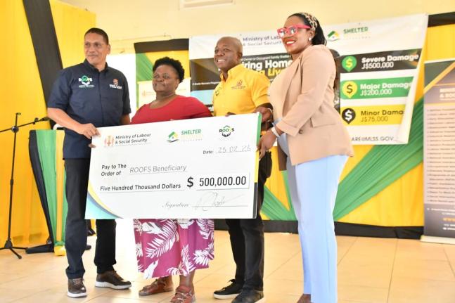 Minister of Labour and Social Security, Pearnel Charles Jr. (second right), presents a cheque to Hanover resident, Ena Campbell (second left), who lost her home during the passage of Hurricane Melissa last year. The occasion was the Hanover leg of the Rest