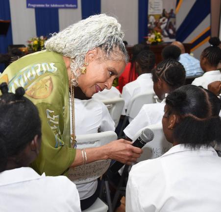 American actress Phylicia Rashad interacts with adolescent mothers during a conversation about motherhood, education and discipline at the Women’s Centre of Jamaica in St Andrew yesterday. 