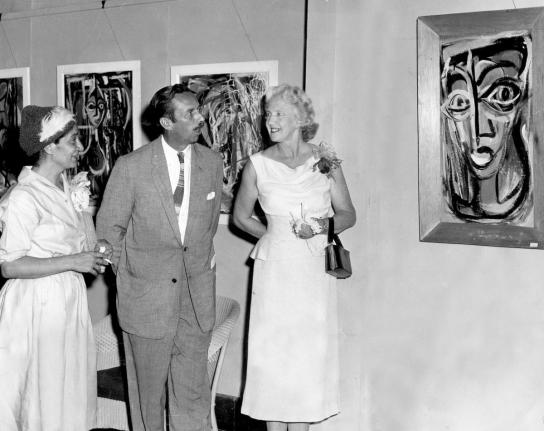 In this 1959 photo (from left) artist Vicki Noonan is seen discussing some of her work with her husband, Tom Noonan and Mrs. Edna Manley, who opened the exhibition at Art Gallery of the Institute of Jamaica.