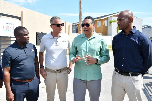 WIHCON CEO Marvin Campbell (left) and ICD CEO Peter Melhado with Prime Minister Dr Andrew Holness (second right) and Dr Alfred Dawes, member of parliament for St Catherine South East, during yesterday’s launch of the Chester Creek housing development in 