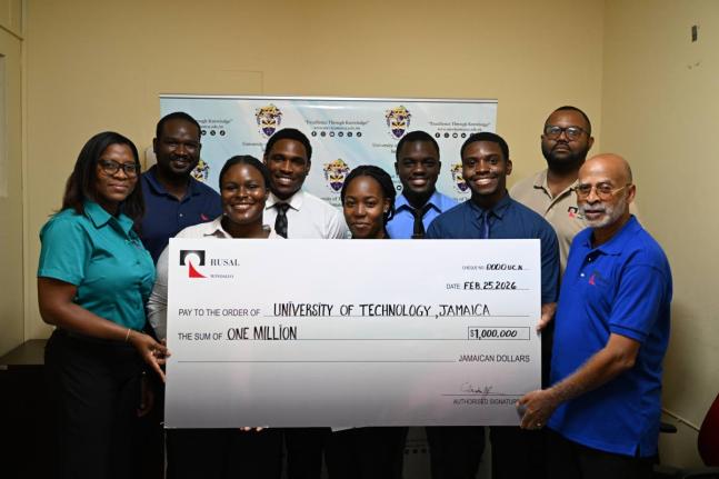 WINDALCO representatives (from left): Snr Information & Public Affairs Officer Monique Grange; Lead Reliability Engineer Judon Kerr; Snr Team Leader Stefan Keane, and Human Resources Director Glendon Johnson surround awardees Romone Dyer, Najae Nelson,  Ja