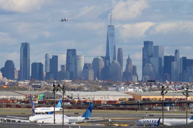 The New York City skyline with a plane approaching an airport on November 6, 2025.  AP 