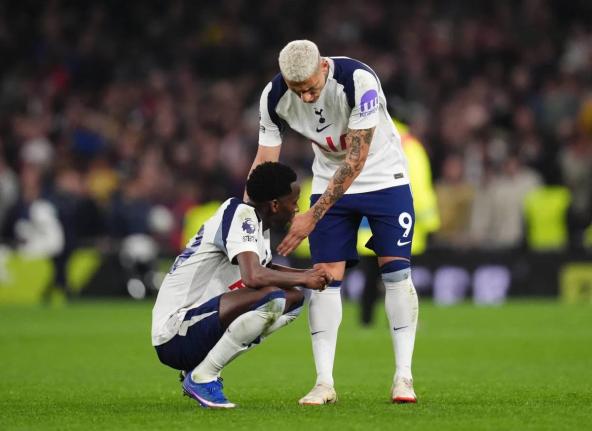  Tottenham Hotspur’s Pape Matar Sarr (left) and Richarlison react after the English Premier League against Crystal Palace in London yesterday.