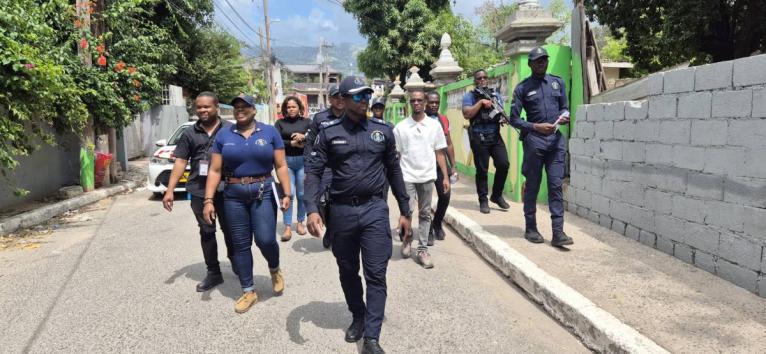 Members of the St Andrew North Police Division and other stakeholders on a community walkthrough in Grants Pen, St Andrew on March 6.
