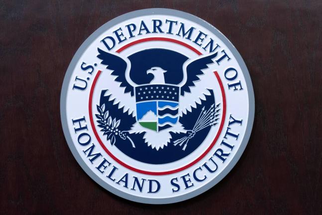 The seal of US Department of Homeland Security is seen before the news conference with Acting director of US Immigration and Customs Enforcement (ICE) Todd Lyons at ICE Headquarters, in Washington, on May 21, 2025. (AP Photo/Jose Luis Magana, File)