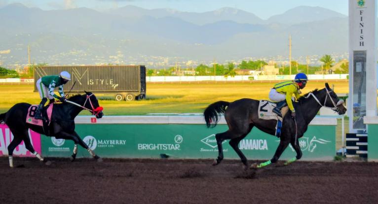 NEO STAR (right), ridden by Tajay Suckoo, wins the second running of the nine-furlongs-and 25-yard International Women’s Day Trophy ahead of  DON KWESI at Caymanas Park on March 7.
