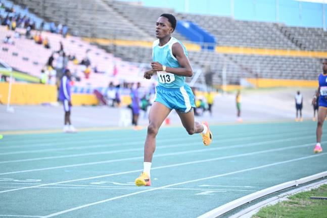 Denbigh High School’s Markland Williams wins the boys’ under-17 800 metres at the Carifta Trials inside the National Stadium on Sunday. 