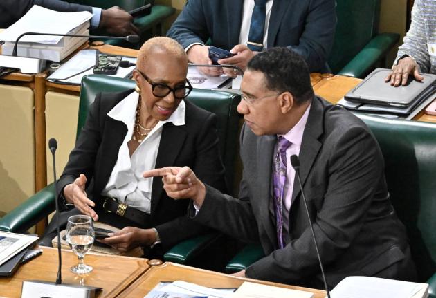 Prime Minister Dr. Andrew Holness (right) with Fayval Williams, minister of finance and the public service at the 2026/27 Budget Debate at Gordon House.