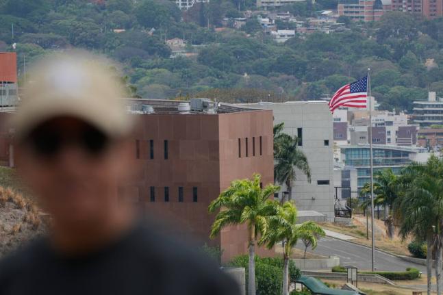 An American flag flies again at the United States Embassy in Caracas, Venezuela, yesterday, seven years after it was lowered when Washington and Caracas cut diplomatic relations in 2019. 